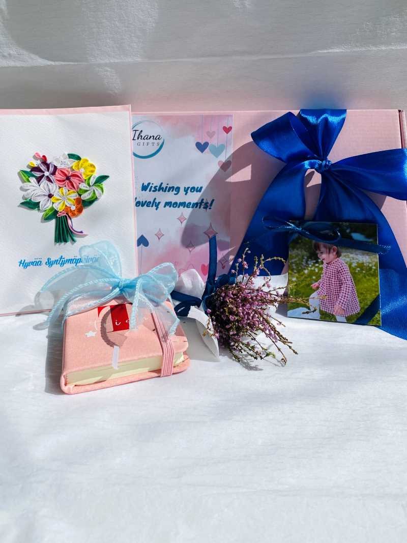 A personalized photo magnet gift set with a ribbon-tied pink box, ready to give as a birthday present